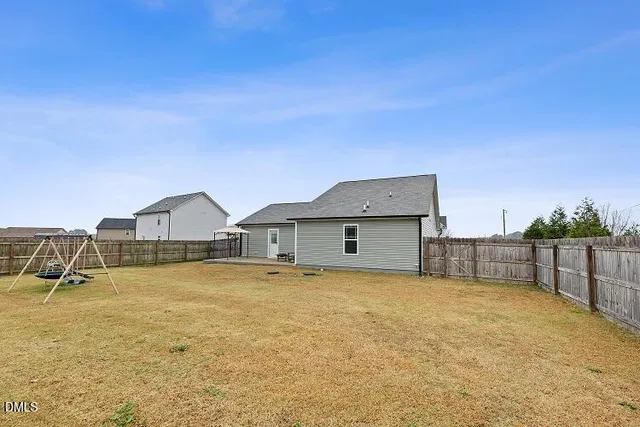a view of an outdoor space and basketball court