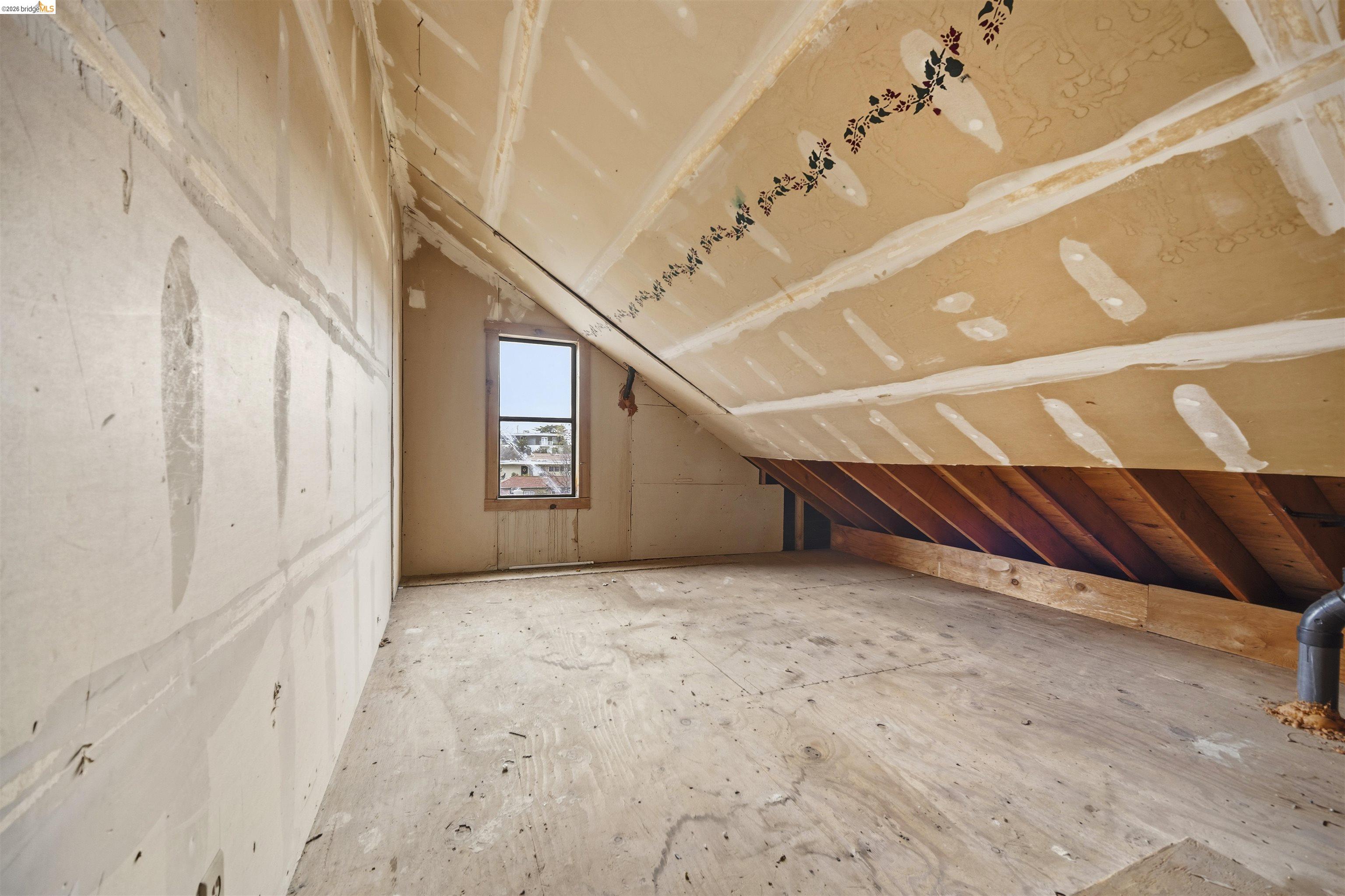 10933 Julius Street, Unit D Oakland, CA 94605 - Photo 21 of 28 a view of an empty room with stairs