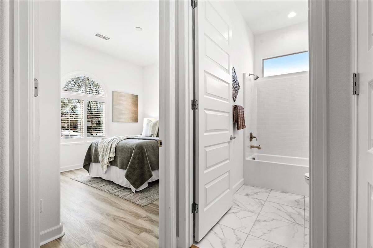 10 Gamay Rancho Mirage, CA 92270 - Photo 20 of 86 a view of a bedroom with a large bed and windows