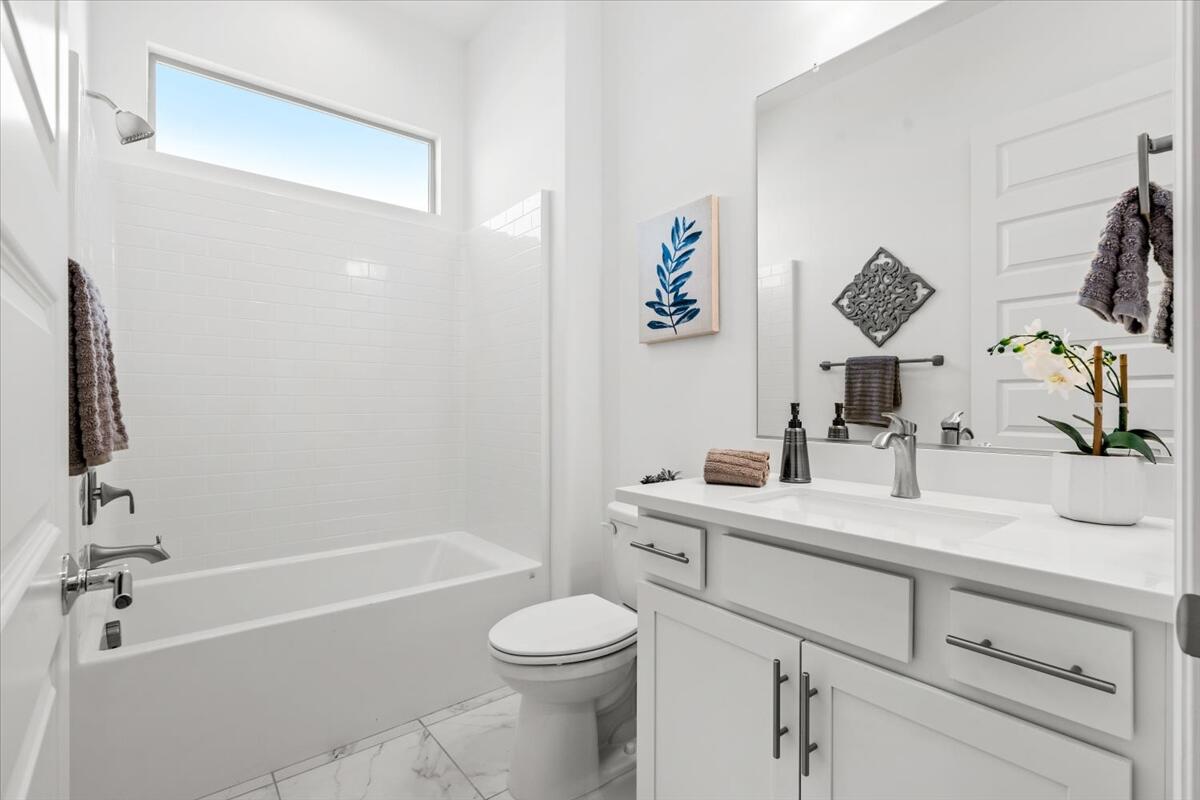 10 Gamay Rancho Mirage, CA 92270 - Photo 22 of 86 a bathroom with a granite countertop sink a toilet and shower