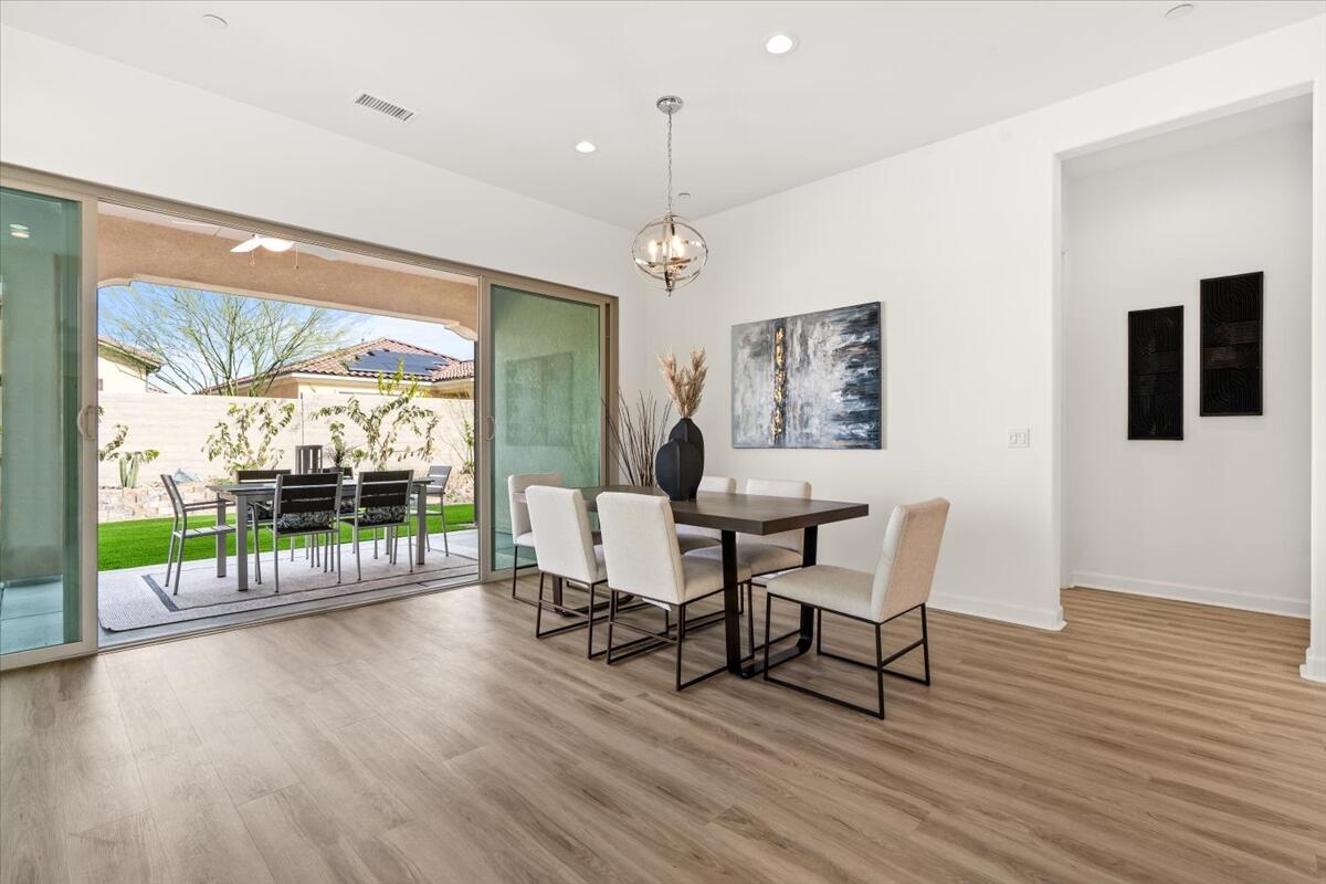 10 Gamay Rancho Mirage, CA 92270 - Photo 28 of 86 a view of a dining room with furniture window and wooden floor