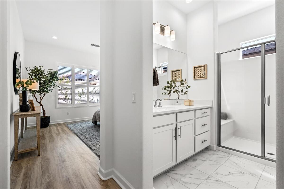 10 Gamay Rancho Mirage, CA 92270 - Photo 30 of 86 a bathroom with a sink a mirror and a shower