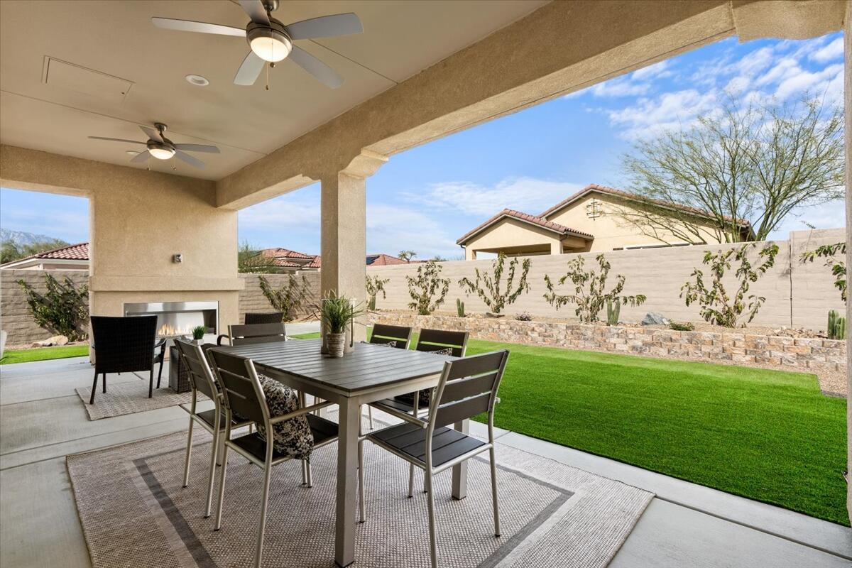10 Gamay Rancho Mirage, CA 92270 - Photo 34 of 86 a view of a dining room with furniture and a garden