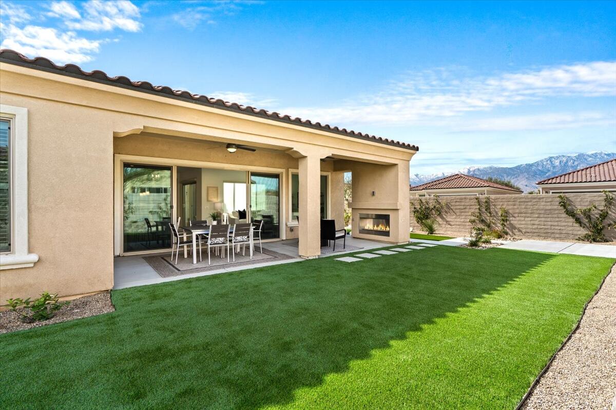 10 Gamay Rancho Mirage, CA 92270 - Photo 37 of 86 a view of backyard of house with outdoor seating and green space