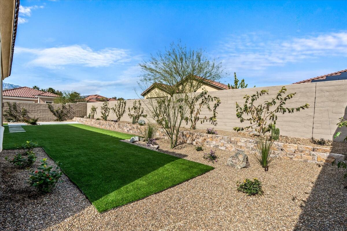 10 Gamay Rancho Mirage, CA 92270 - Photo 40 of 86 a view of a garden with a building in the background