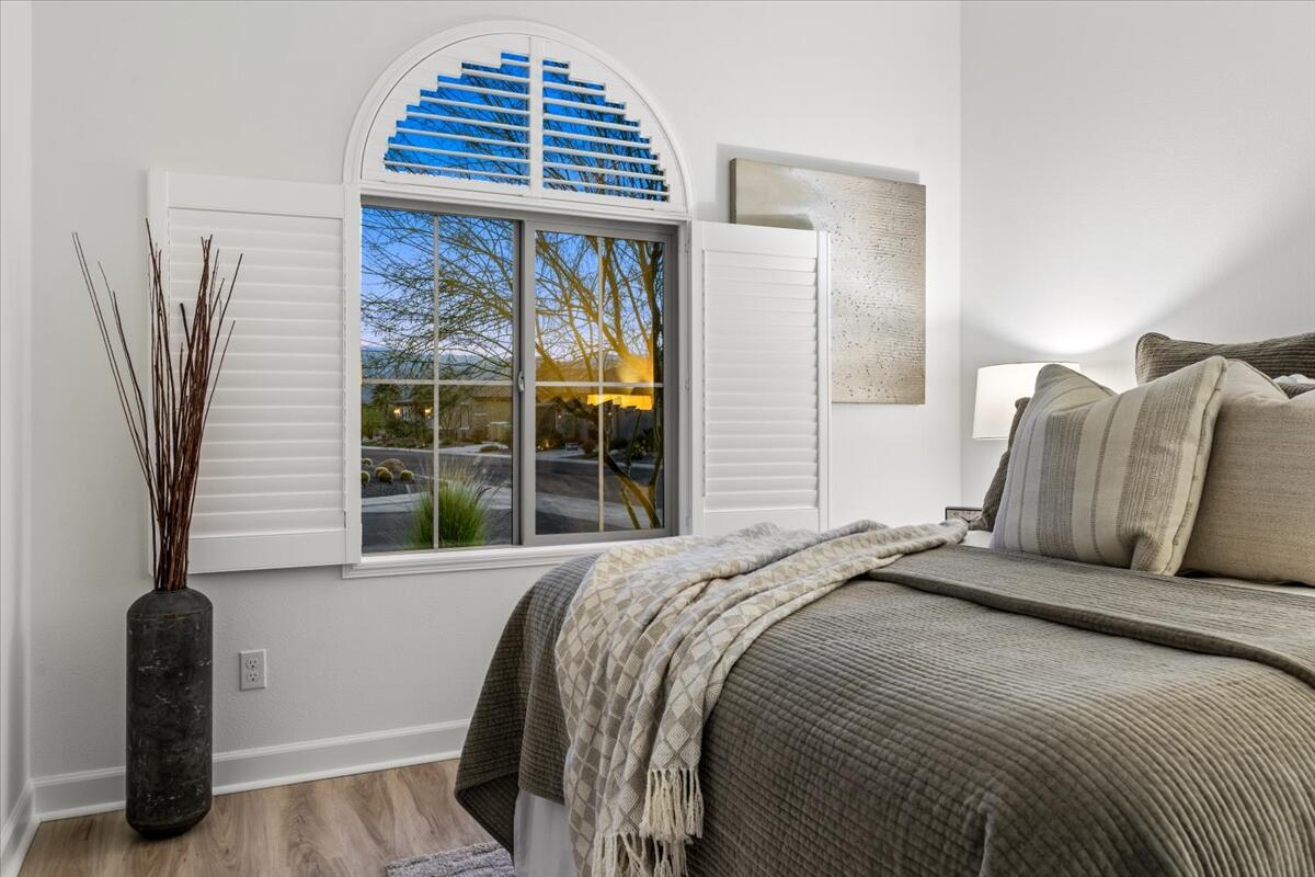 10 Gamay Rancho Mirage, CA 92270 - Photo 48 of 86 a bedroom with a bed and a chair with outer view