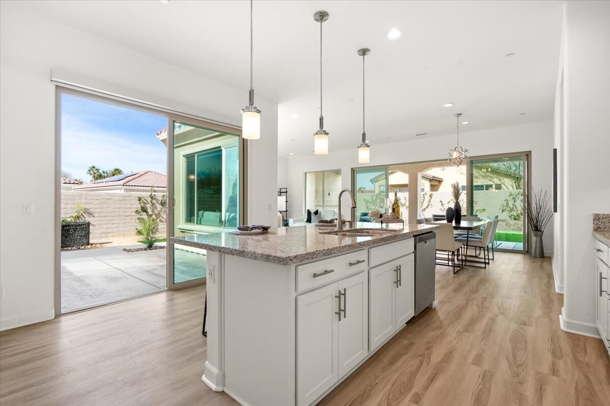 10 Gamay Rancho Mirage, CA 92270 - Photo 5 of 86 a kitchen with stainless steel appliances granite countertop wooden floors and sink