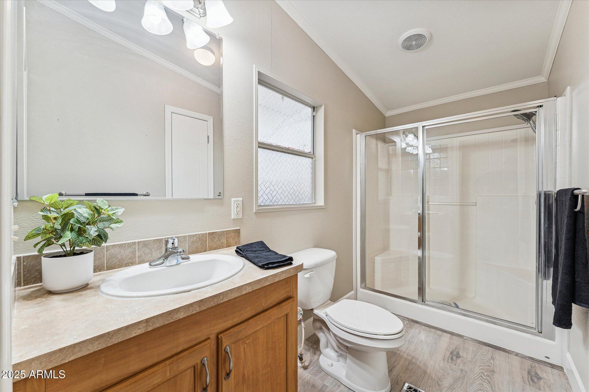 3330 East Main Street, Unit 111 Mesa, AZ 85213 - Photo 13 of 24 a bathroom with a sink toilet and shower