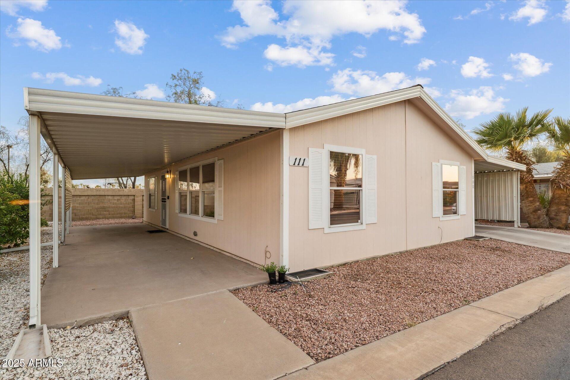 3330 East Main Street, Unit 111 Mesa, AZ 85213 - Photo 19 of 24 a view of house with an outdoor space