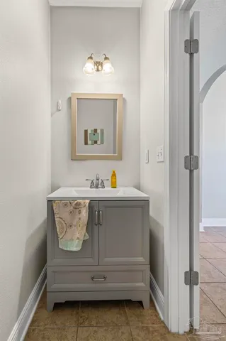 a kitchen with a sink a counter top space and stainless steel appliances