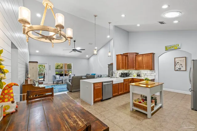 a large kitchen with a table and chairs