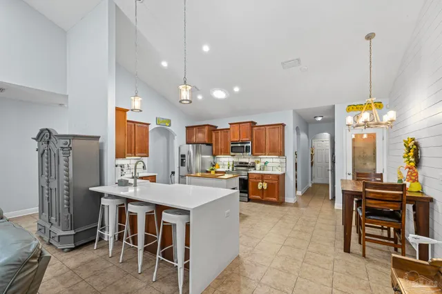 a kitchen that has a lot of cabinets in it and a refrigerator