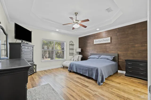 a bathroom with a granite countertop sink a toilet a shower and a mirror