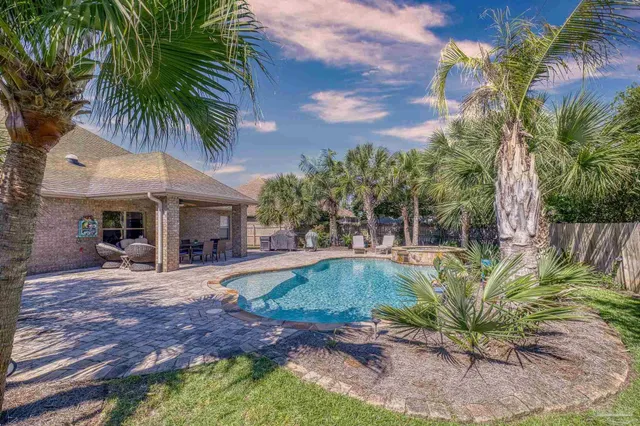 a view of a swimming pool with a patio