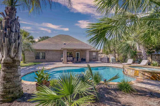 an aerial view of a house with a garden