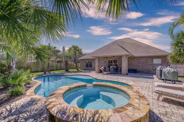 a room with a stove and a kitchen view