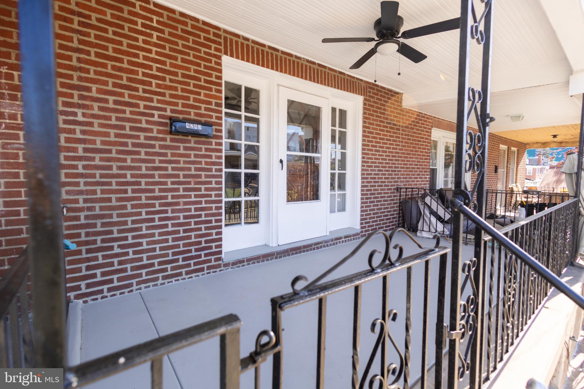 a view of balcony with wooden floor and white walls