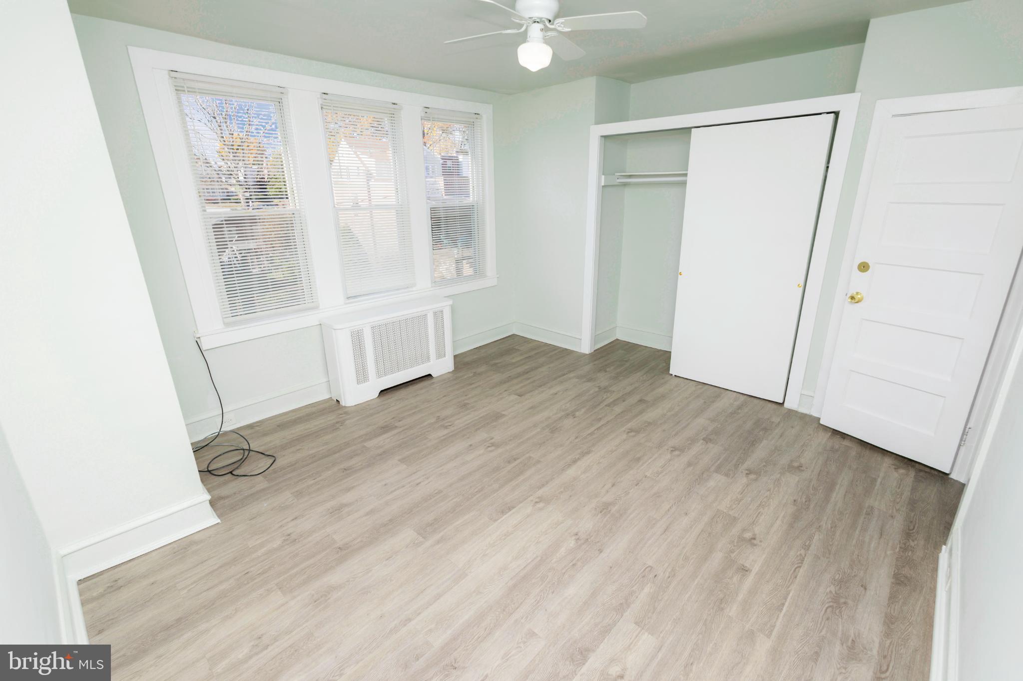 4243 Frost Street Philadelphia, PA 19136 - Photo 14 of 28 an empty room with wooden floor and windows