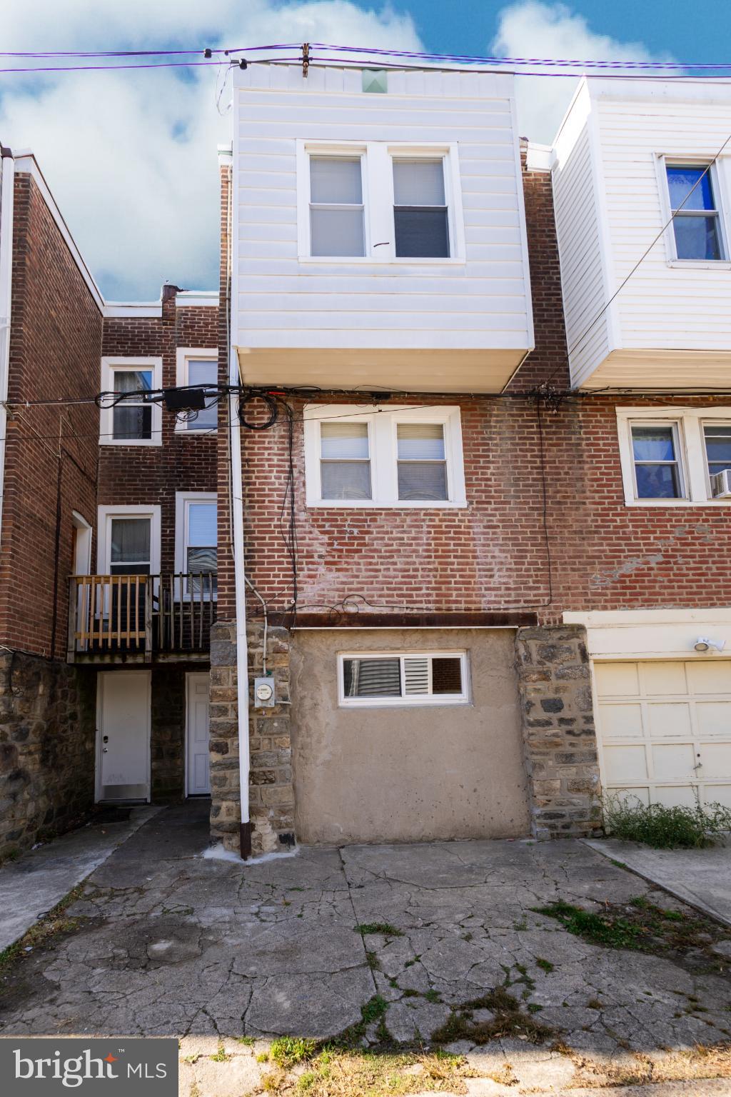 4243 Frost Street Philadelphia, PA 19136 - Photo 24 of 28 a front view of a house with a yard