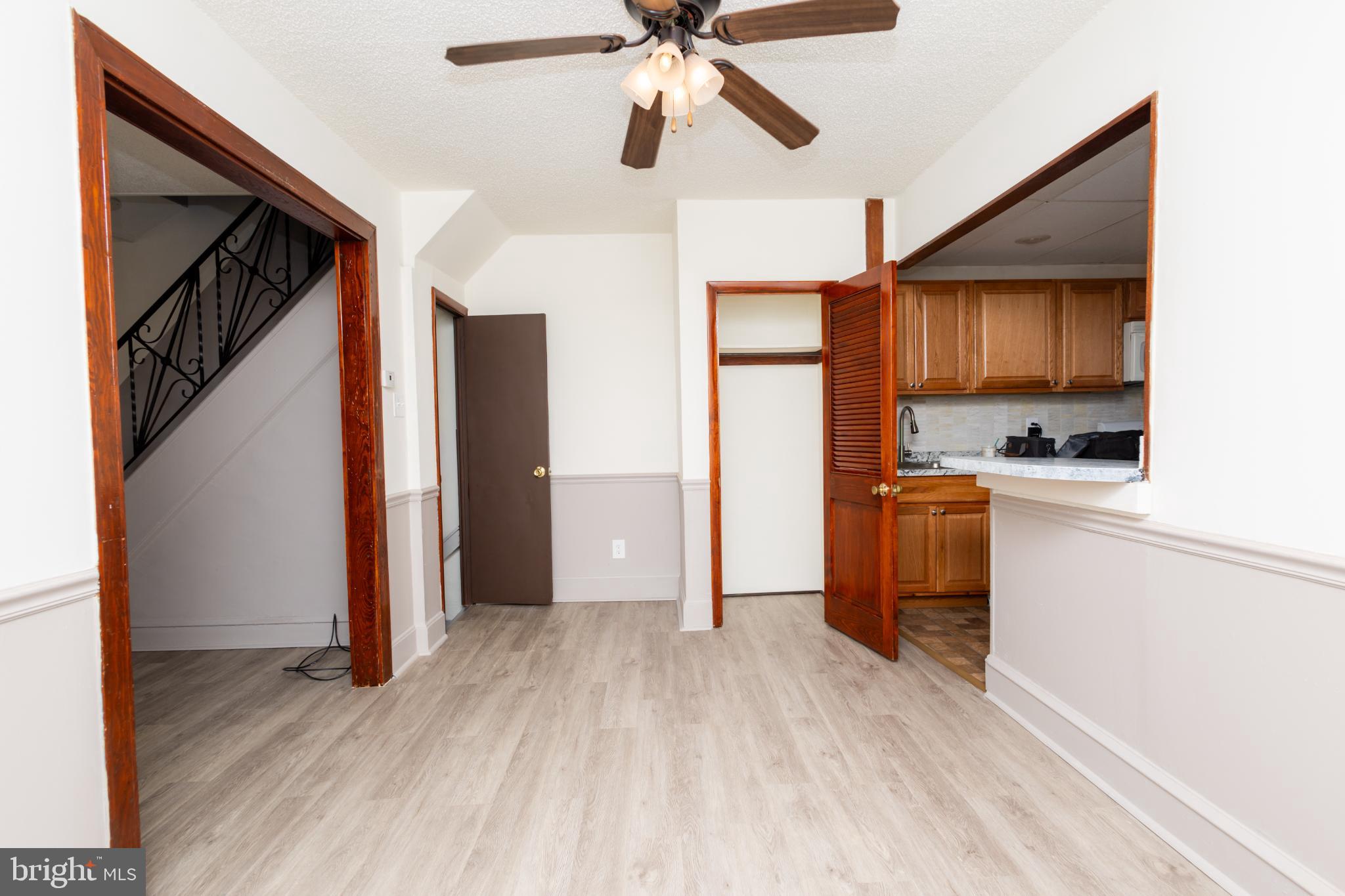 4243 Frost Street Philadelphia, PA 19136 - Photo 8 of 28 a view of kitchen with stainless steel appliances wooden floor cabinets and a window