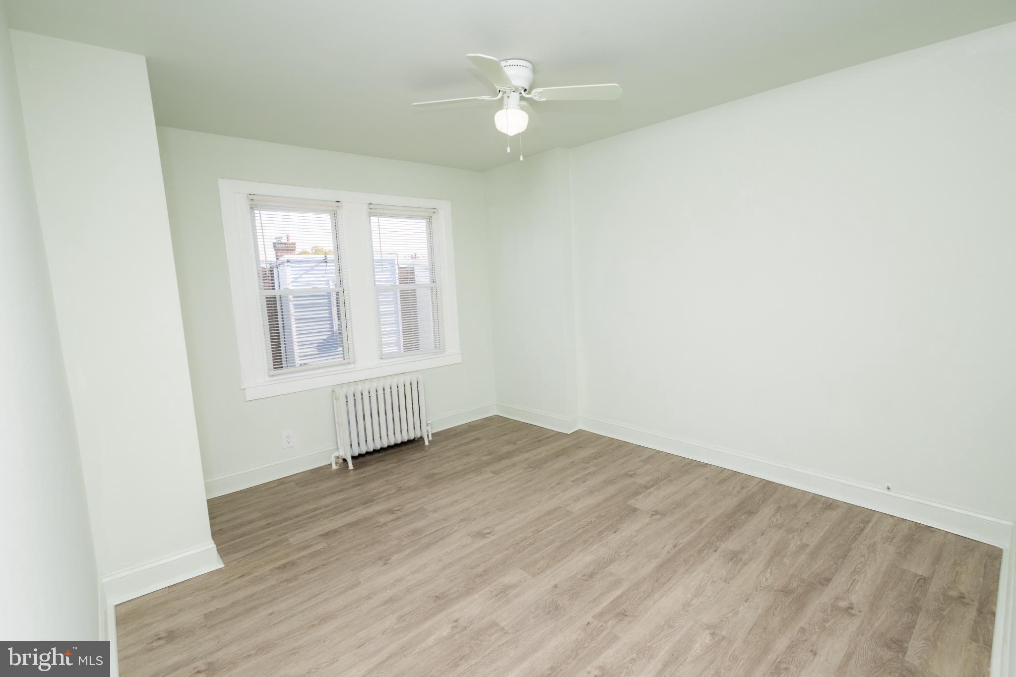 4243 Frost Street Philadelphia, PA 19136 - Photo 9 of 28 an empty room with windows and a ceiling fan