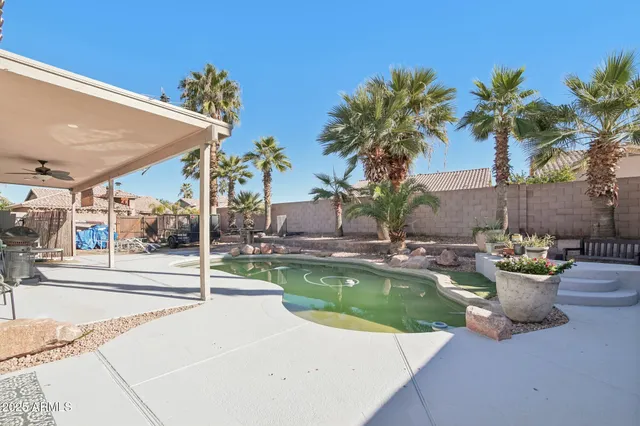 a swimming pool with a outdoor seating