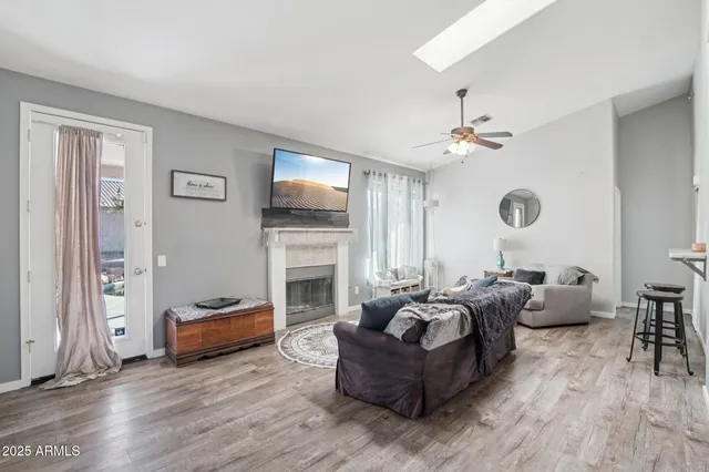 a view of a livingroom with furniture and windows