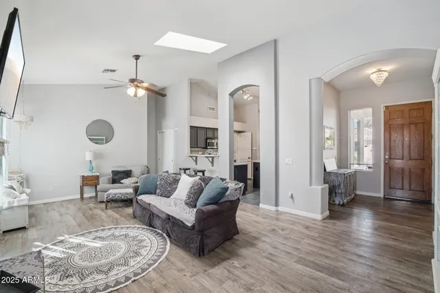 a living room with furniture fireplace and flat screen tv