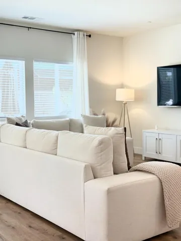 a living room with a couch and a flat screen tv