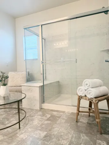 a bathroom with a shower toilet and a sink