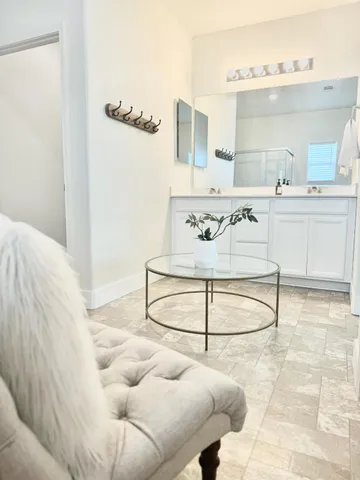a bathroom with a sink and mirror