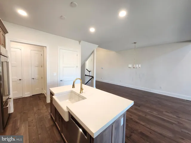 a view of kitchen island with wooden floor