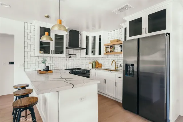 a view of a hallway with a furniture and a living room