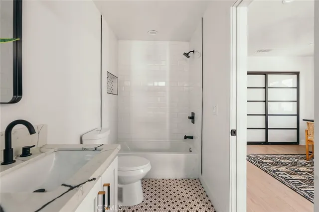 a bed room with a bed and a window