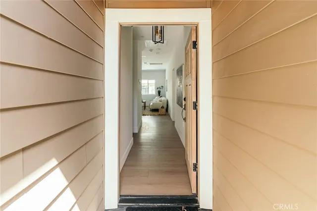 a kitchen with a dining table chairs sink and stove