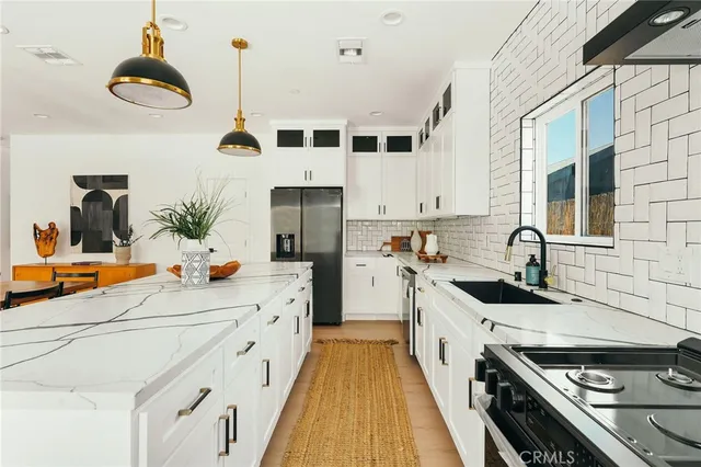 a bedroom with a bed a table and a painting