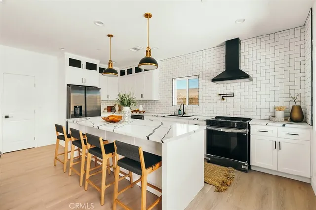 a bathroom with a toilet sink vanity and mirror