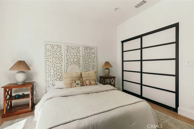 a bedroom with a bed and a couch