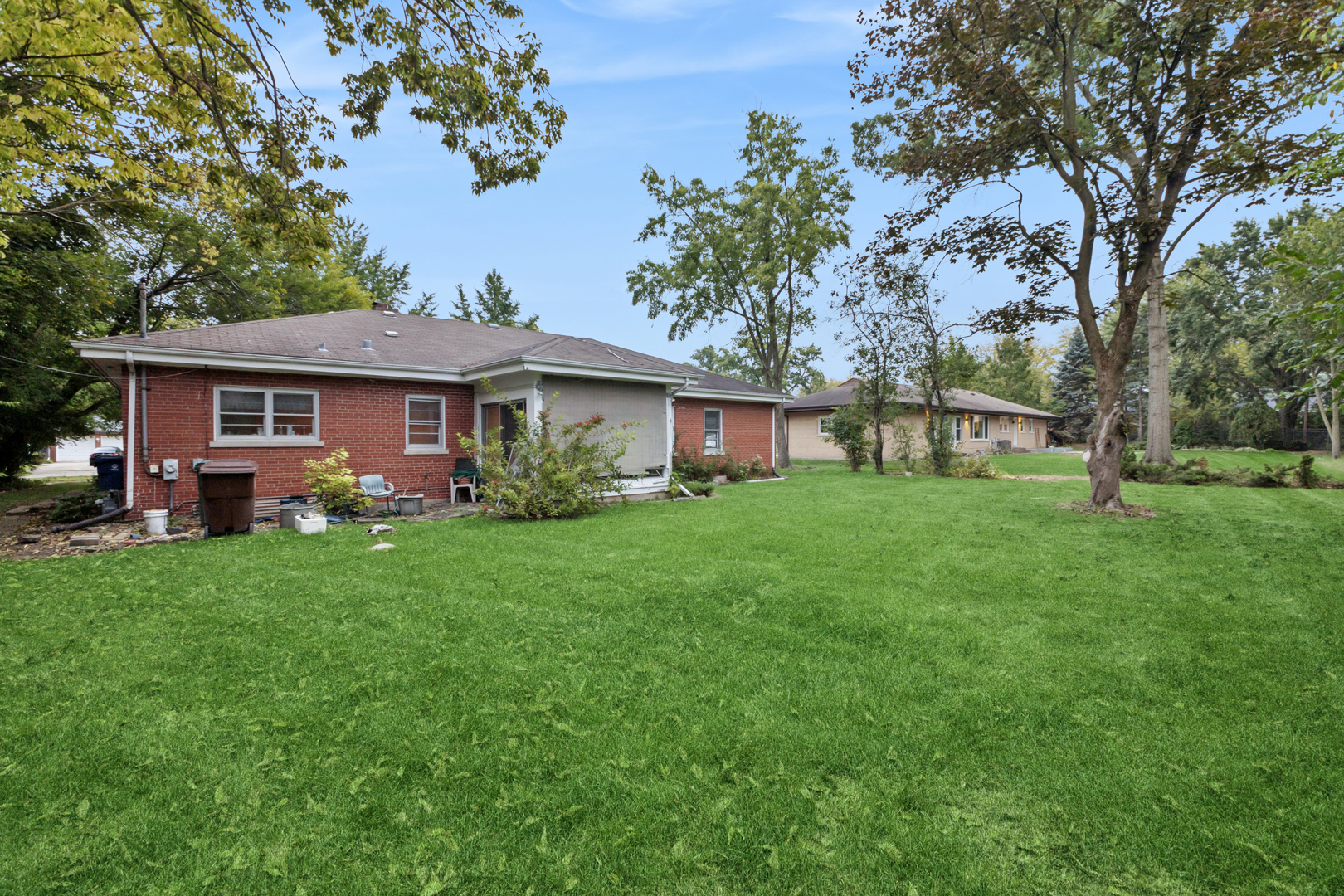950 Gardner Road Flossmoor, IL 60422 - Photo 6 of 21 a front view of a house with a garden