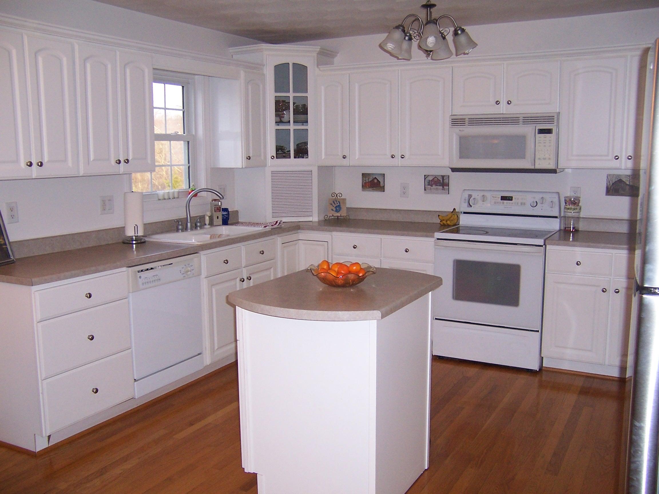 1700 Meadows Road Vinton, VA 24179 - Photo 2 of 27 a kitchen with cabinets appliances a sink and a window