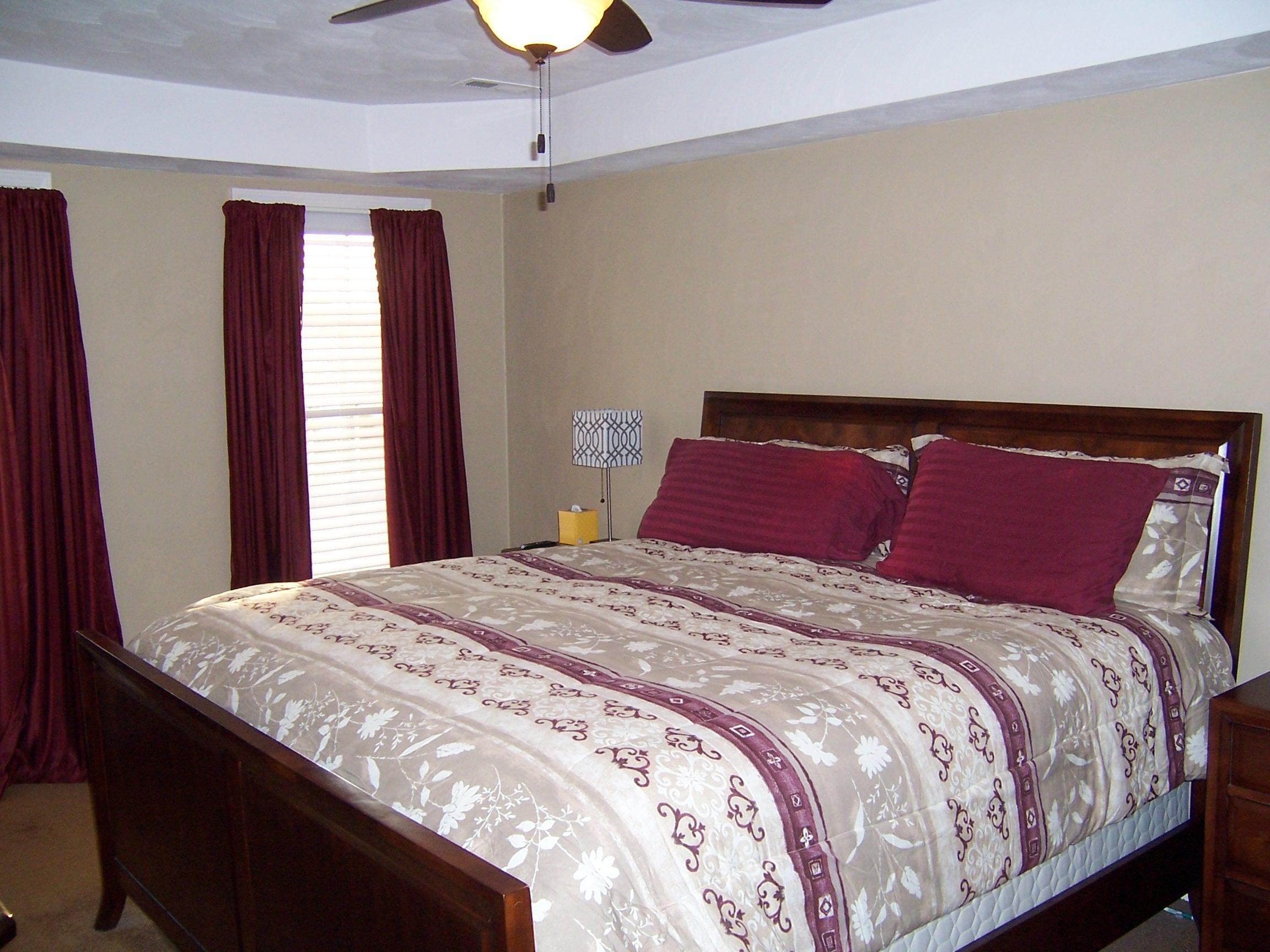 1700 Meadows Road Vinton, VA 24179 - Photo 11 of 27 a bedroom with a large bed and a window