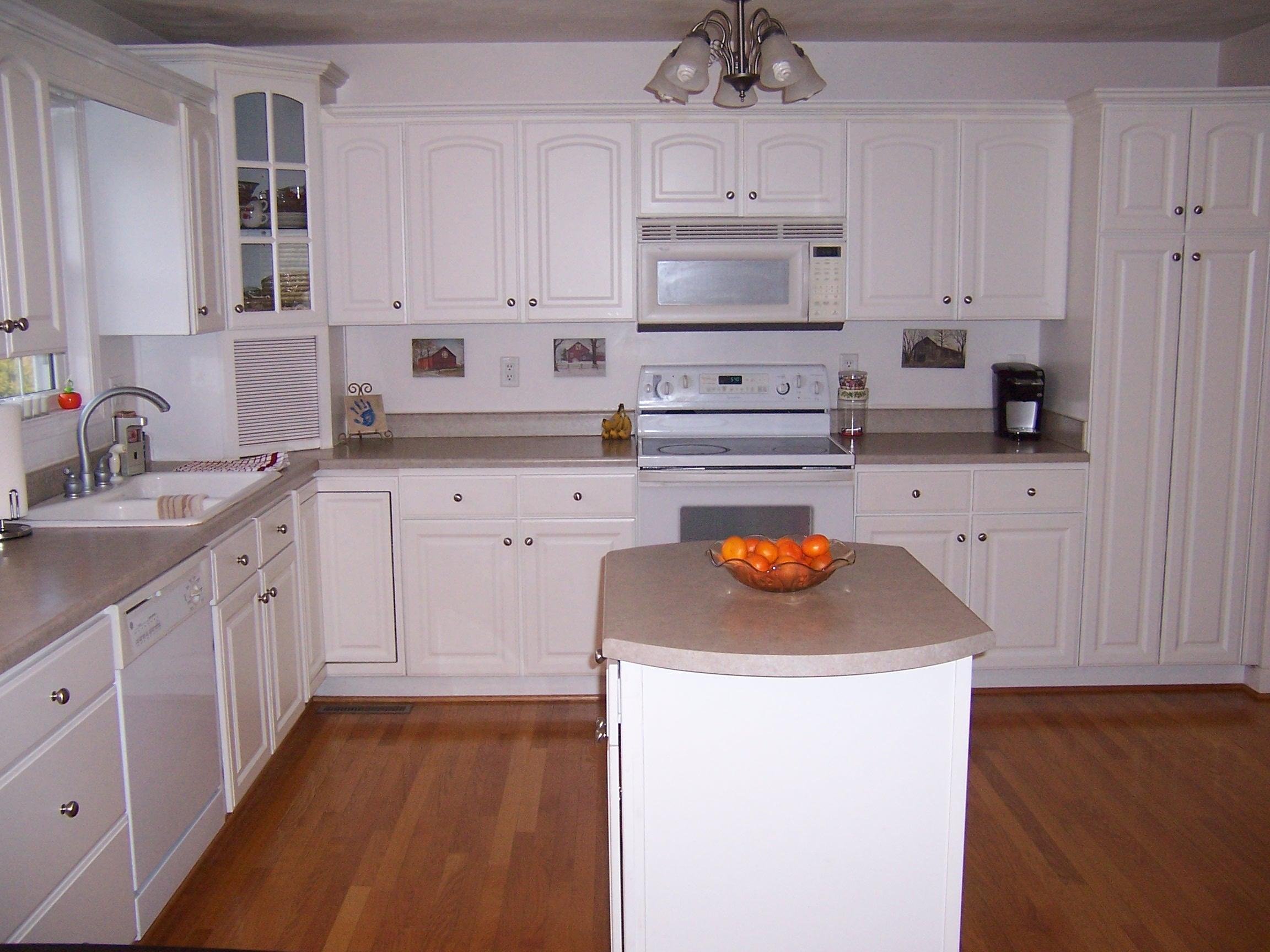 1700 Meadows Road Vinton, VA 24179 - Photo 3 of 27 a kitchen with granite countertop white cabinets and white appliances