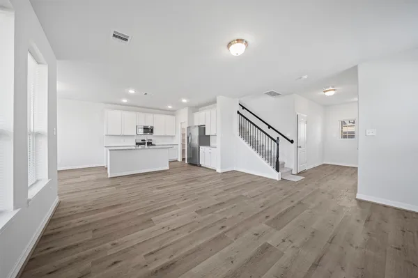 a view of kitchen with wooden floor