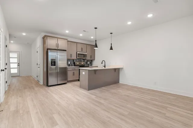 a view of kitchen with wooden floor