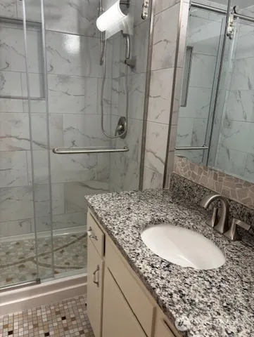 a bathroom with a sink and a mirror