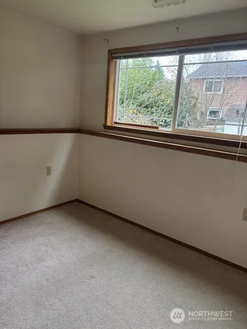 a view of a room that has a window