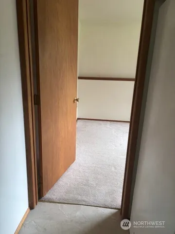 a kitchen with stainless steel appliances and white cabinets