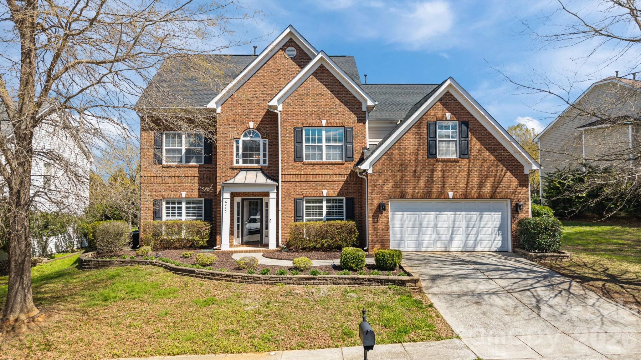 6226 Hermsley Road Charlotte, NC 28278 - Photo 1 of 47 a front view of a house with a yard