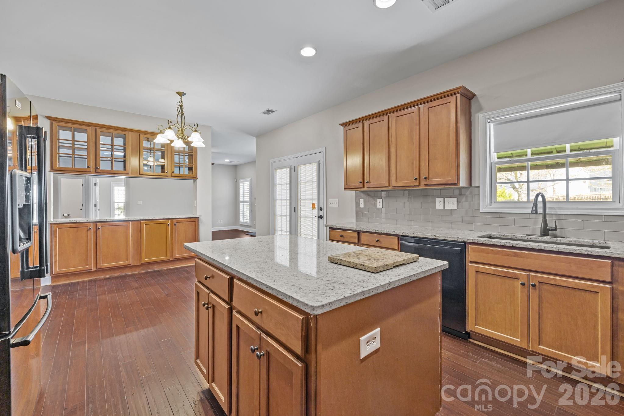 6226 Hermsley Road Charlotte, NC 28278 - Photo 17 of 47 a kitchen that has a sink cabinets counter space and appliances