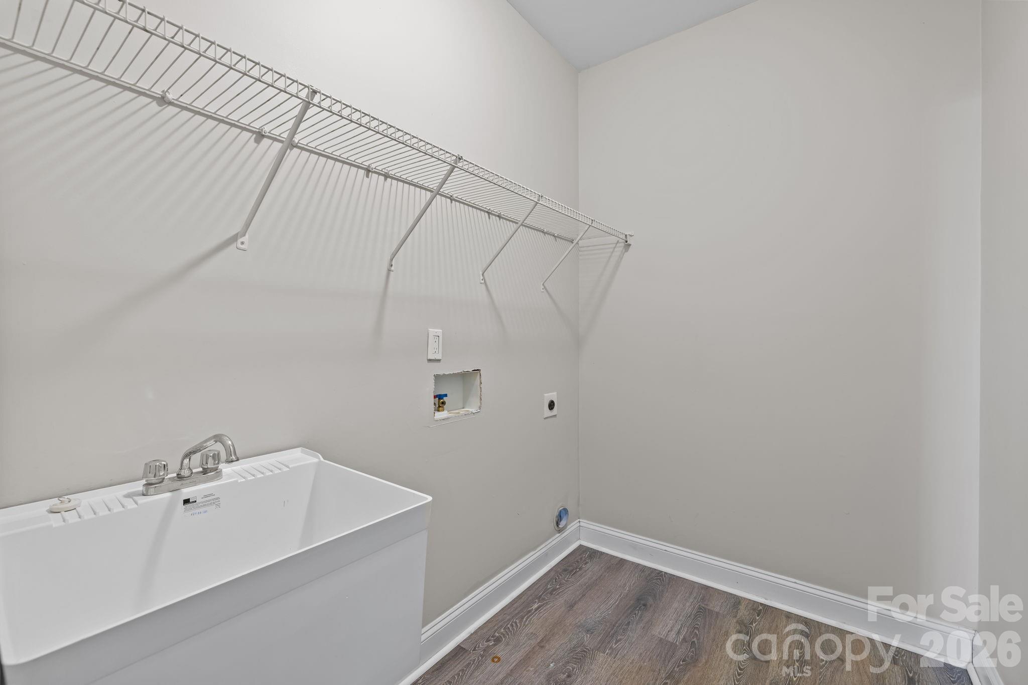 6226 Hermsley Road Charlotte, NC 28278 - Photo 19 of 47 a bathroom with a sink and vanity
